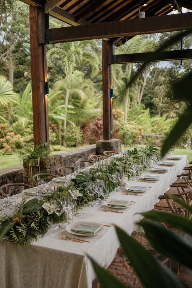 Small group of executives conversing during a retreat welcome reception outdoors